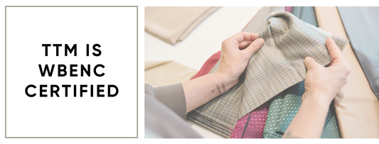 Overhead image of woman's hands working with fabric