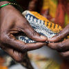 woman garment maker's hands holding fabric